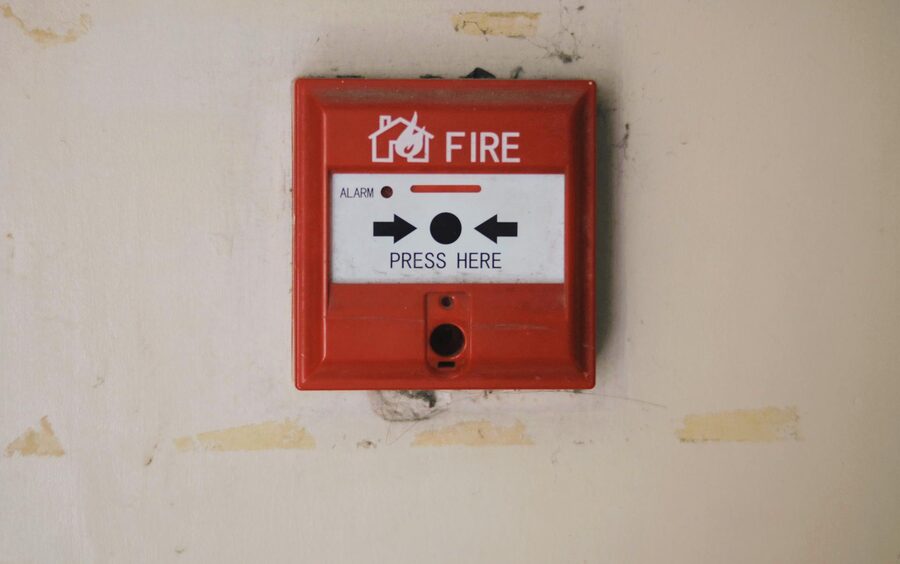 A fire extinguisher being checked during safety training