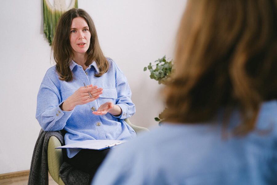 A carer calmly de-escalating a difficult situation